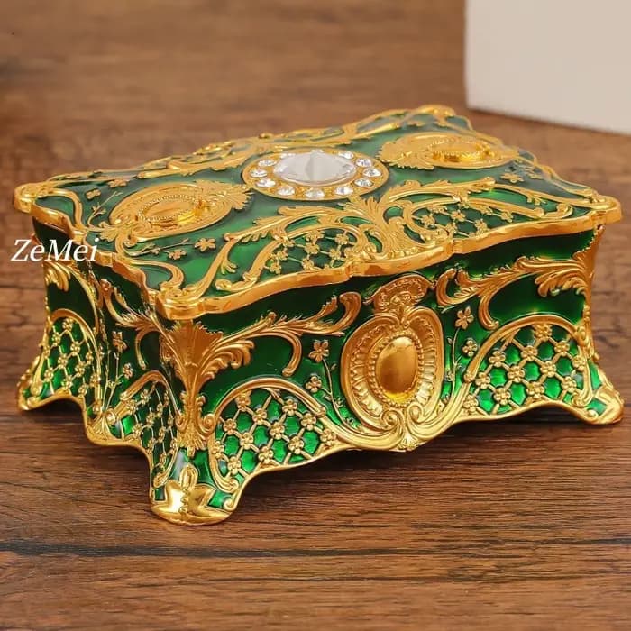 Boîte à bijoux vintage élégante avec détails dorés
