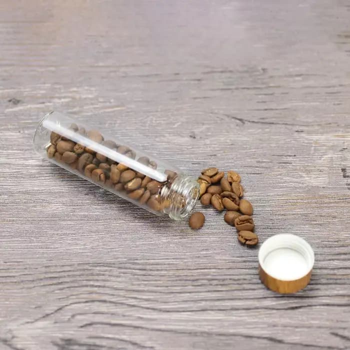 Petite bouteille en verre scellée en bois de hêtre