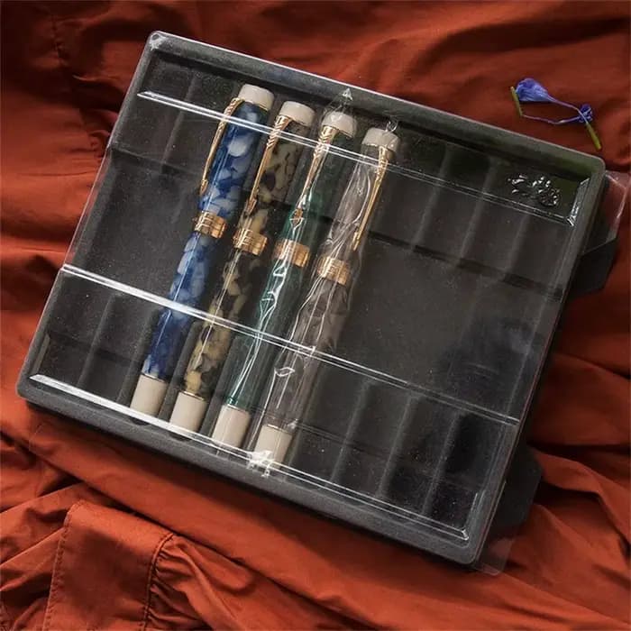 Boîte à stylos à plume transparente