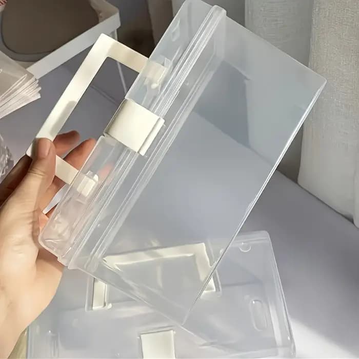 La grande boîte de rangement transparente à poignée