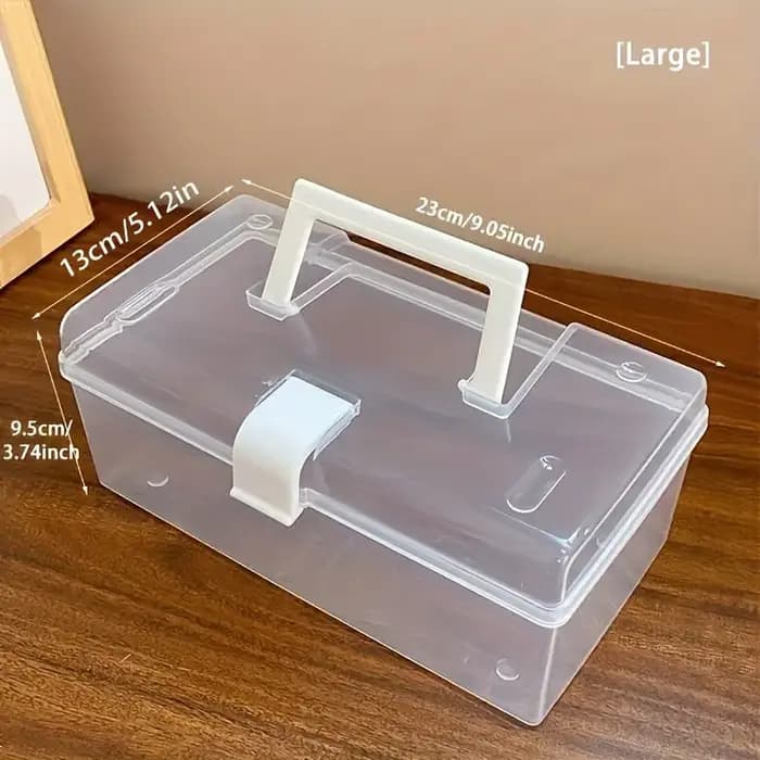 La grande boîte de rangement transparente à poignée
